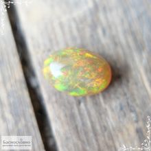 Огненный опал из Эфиопии огранка овал кабошон 14x9,88мм 4,14 карат