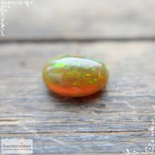 Огненный опал из Эфиопии огранка овал кабошон 14x9,88мм 4,14 карат